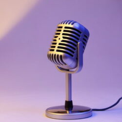 retro microphone isolated on color background